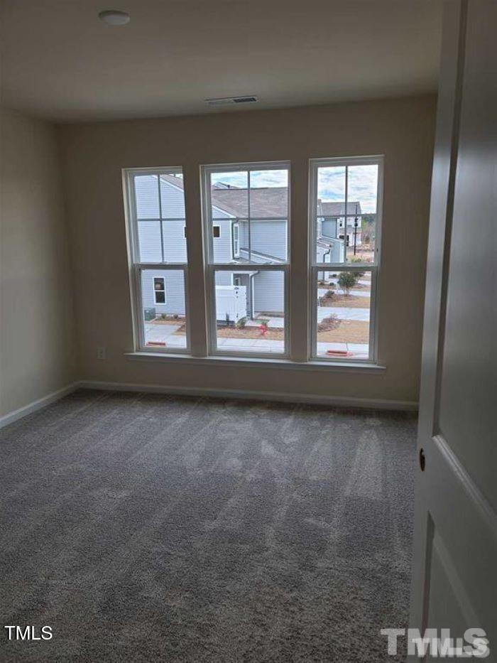 401 Purdue Drive Durham, NC 27713 - Photo 8 of 14 an empty room with windows