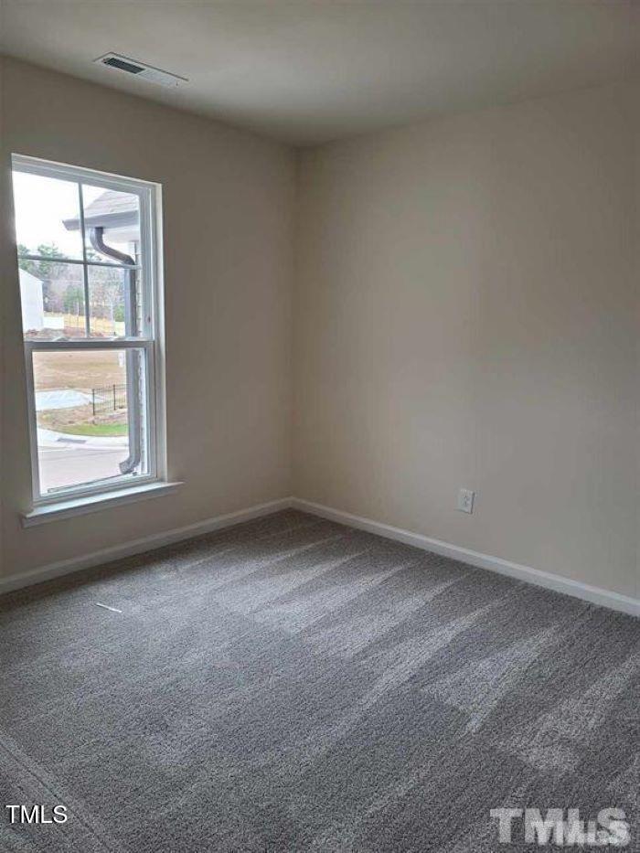 401 Purdue Drive Durham, NC 27713 - Photo 9 of 14 an empty room with a window
