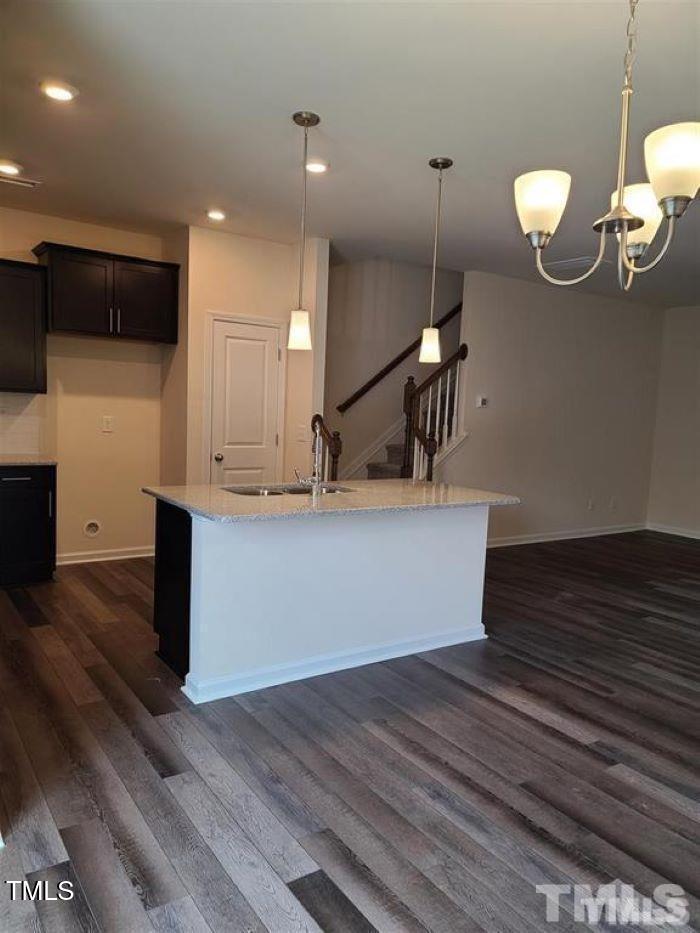 401 Purdue Drive Durham, NC 27713 - Photo 10 of 14 a kitchen with a refrigerator and a table