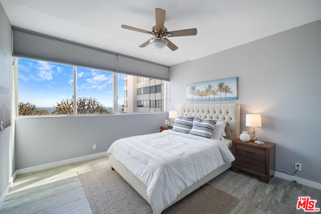 17352 Sunset Boulevard, Unit 202 Pacific Palisades, CA 90272 - Photo 18 of 30 a bedroom with a large bed and a window