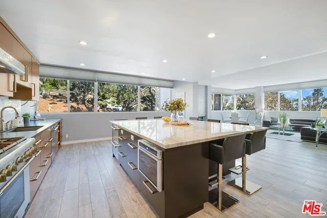 a bathroom with a double vanity sink a mirror and shower