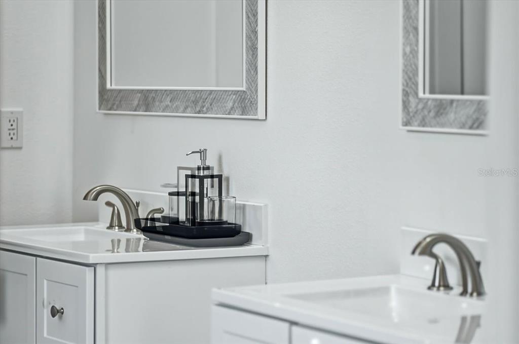 1215 Rio De Janeiro Avenue Punta Gorda, FL 33983 - Photo 47 of 65 a bathroom with a sink and a mirror