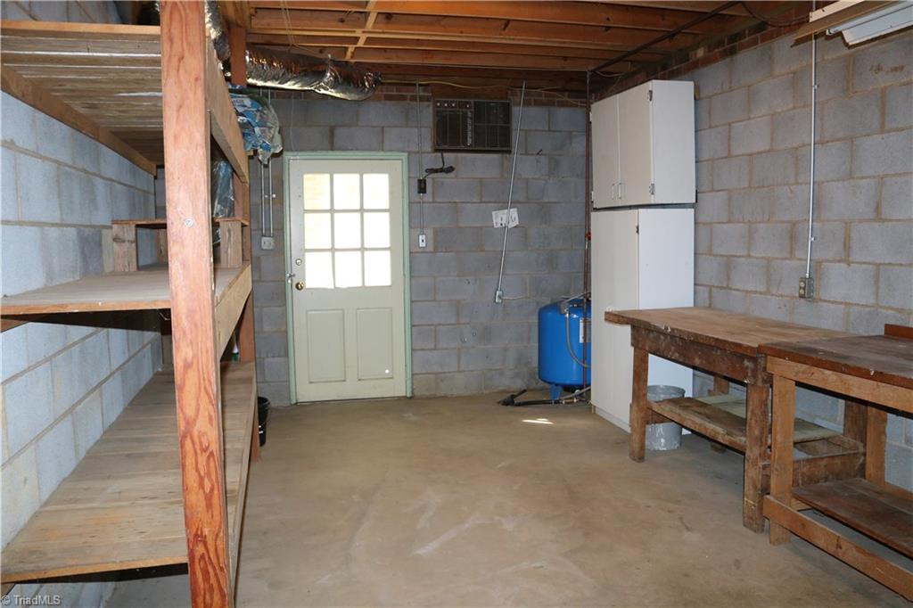 2105 Hickswood Road High Point, NC 27265 - Photo 22 of 24 A storage room in the basement with another entrance to the outside.