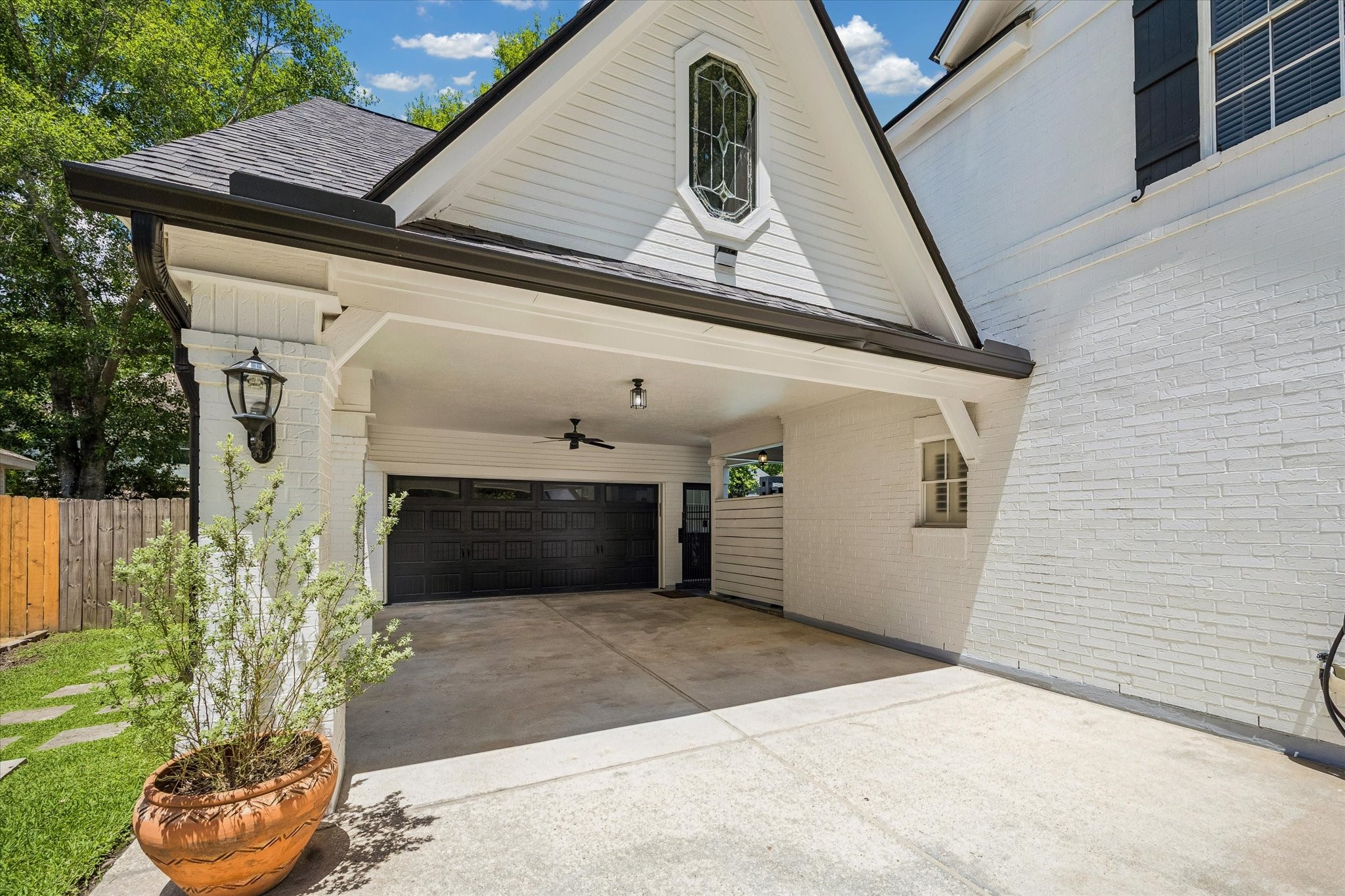 146 Golden Shadow Circle Spring, TX 77381 - Photo 3 of 41 The covered porte-cochère enhances the home's character, guiding you to the detached garage through a private, sheltered passage that feels both inviting and refined.