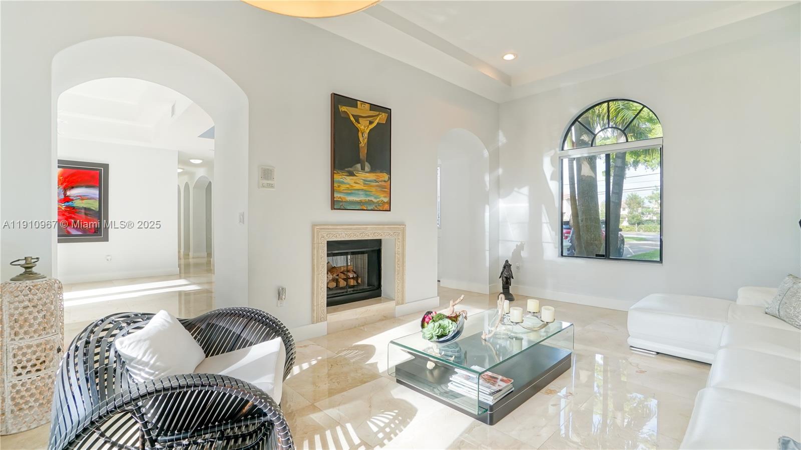 6950 Southwest 97th Avenue Miami, FL 33173 - Photo 12 of 22 a living room with furniture and a fireplace