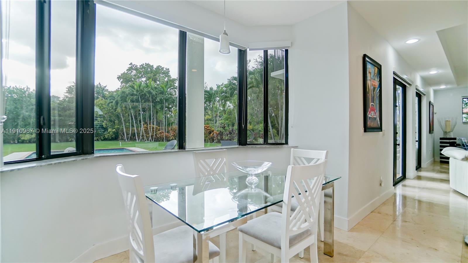 6950 Southwest 97th Avenue Miami, FL 33173 - Photo 21 of 22 a living room with furniture and large windows