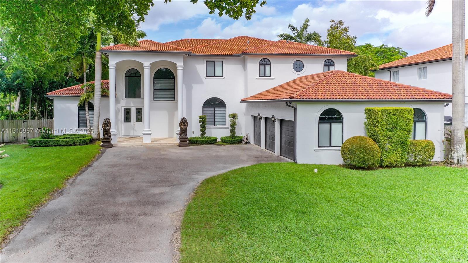 6950 Southwest 97th Avenue Miami, FL 33173 - Photo 4 of 22 a front view of a house with a yard