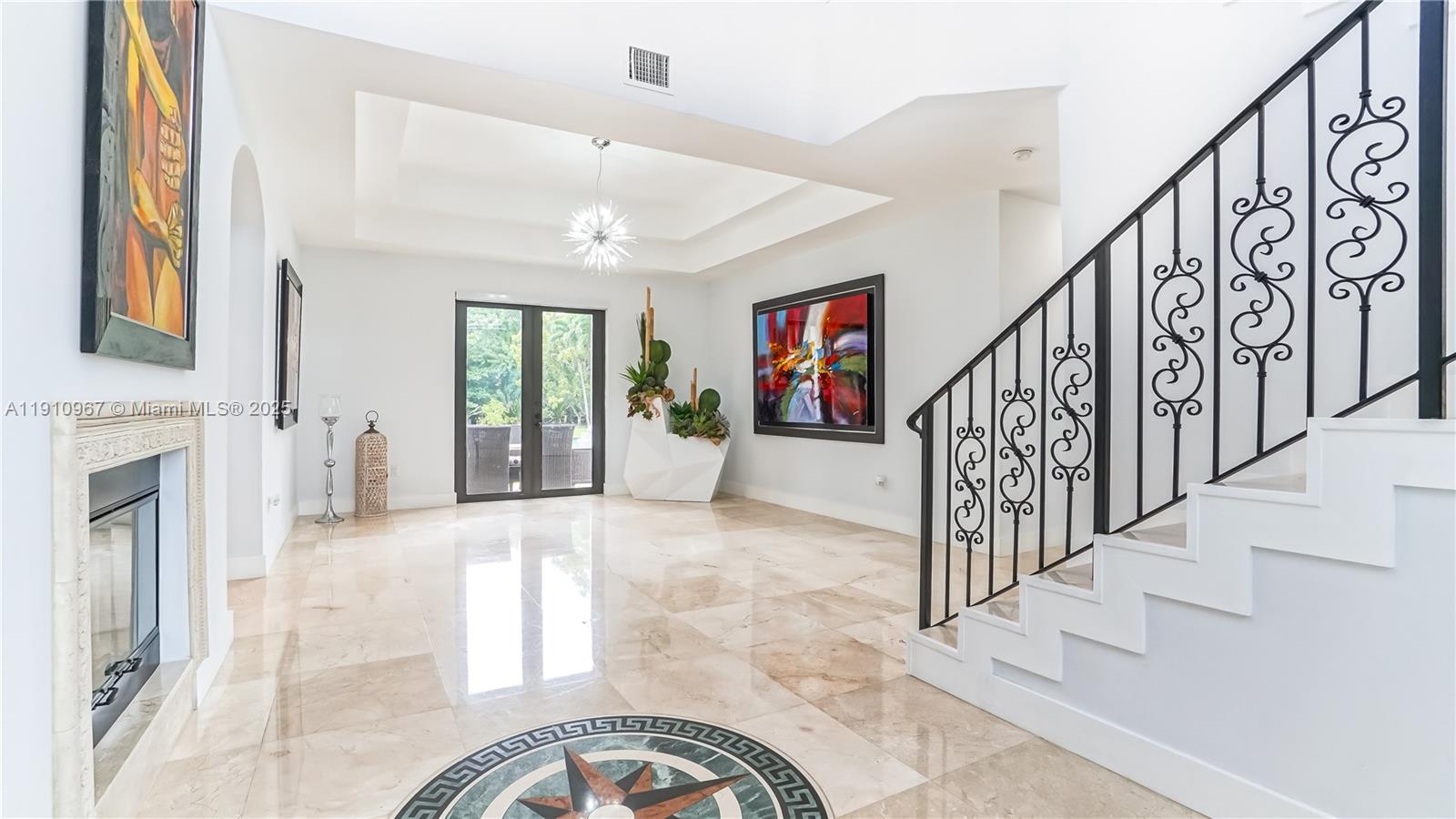 6950 Southwest 97th Avenue Miami, FL 33173 - Photo 5 of 22 a view of entryway and hall with wooden floor
