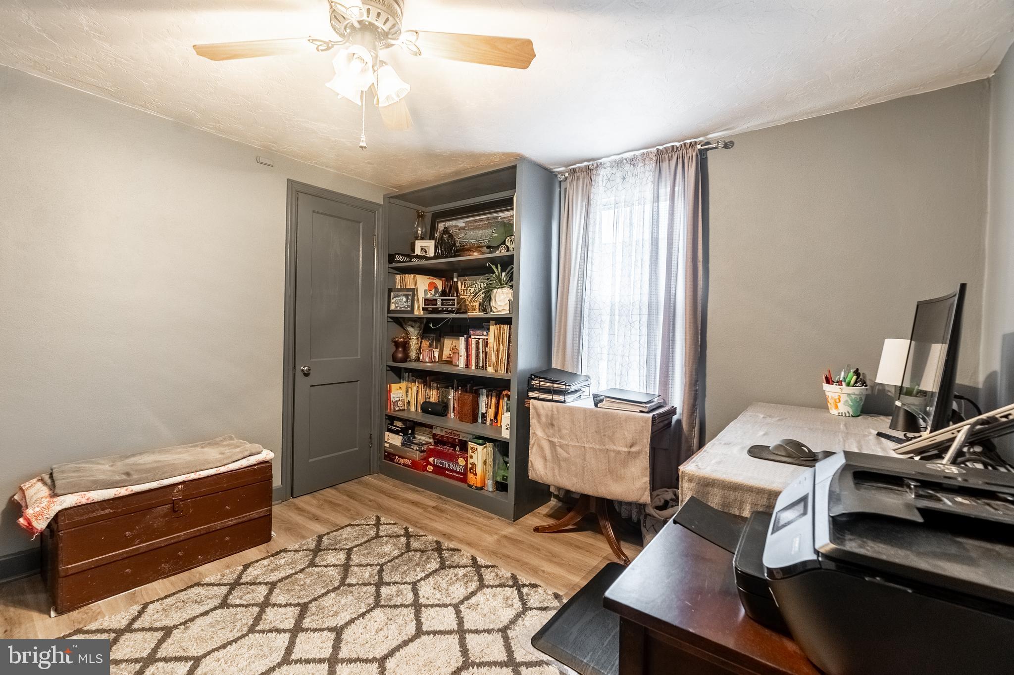 311 Wirt Avenue Hanover, PA 17331 - Photo 16 of 37 a room with furniture a bookshelf and a window