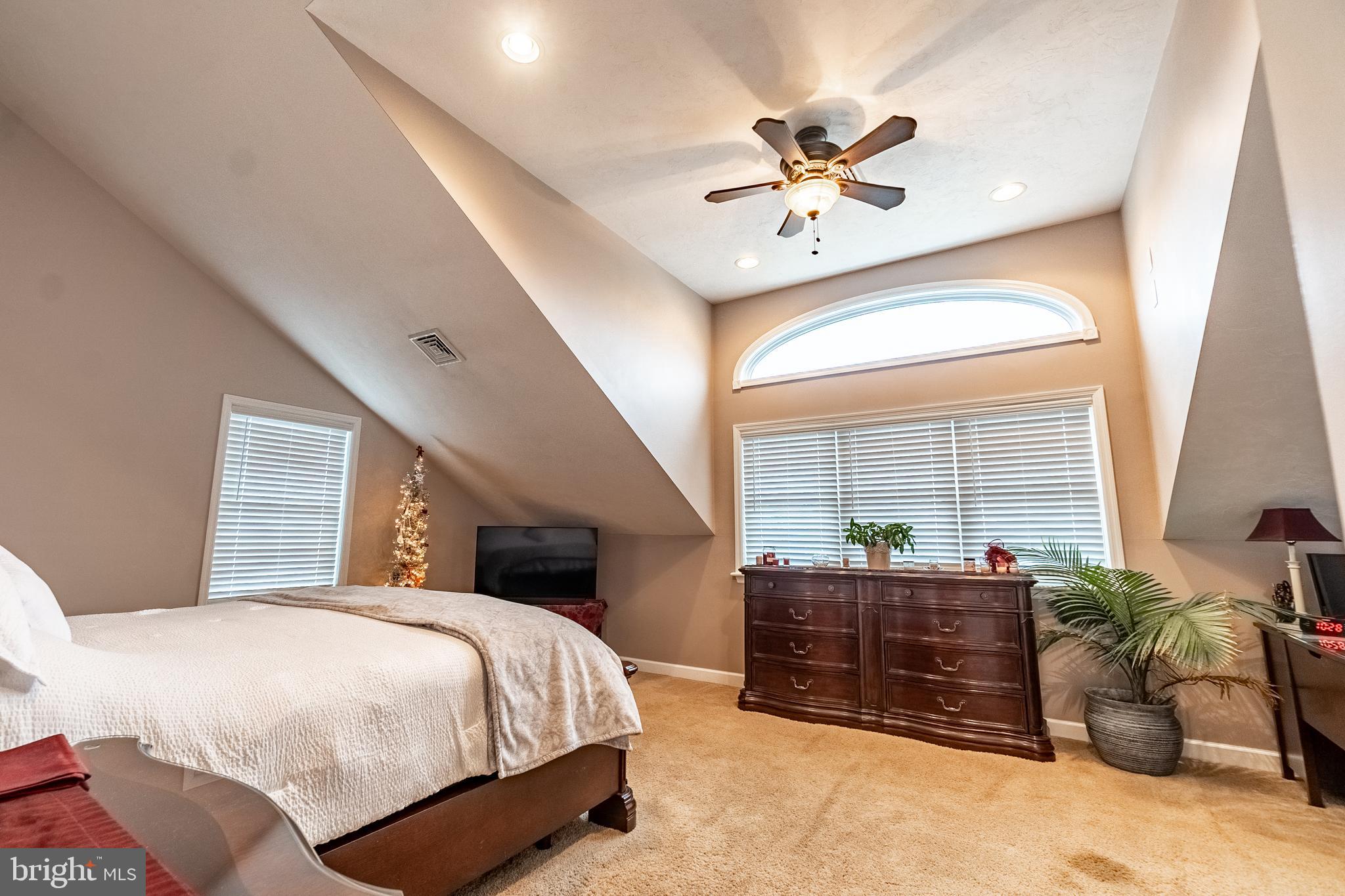 311 Wirt Avenue Hanover, PA 17331 - Photo 17 of 37 a bedroom with a large bed and a chandelier