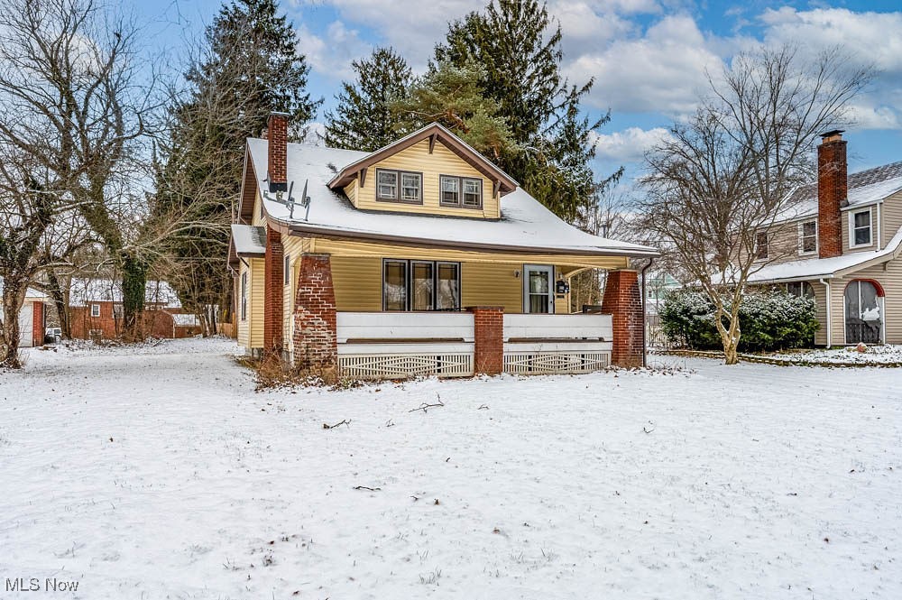 3114 Neosho Road Youngstown, OH 44511 - Photo 2 of 25 View of front facade featuring covered porch and a chimney