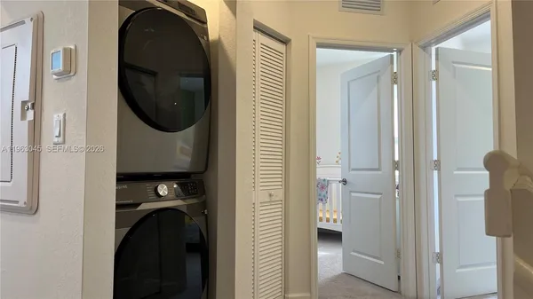 a bedroom with a bed and a mirror
