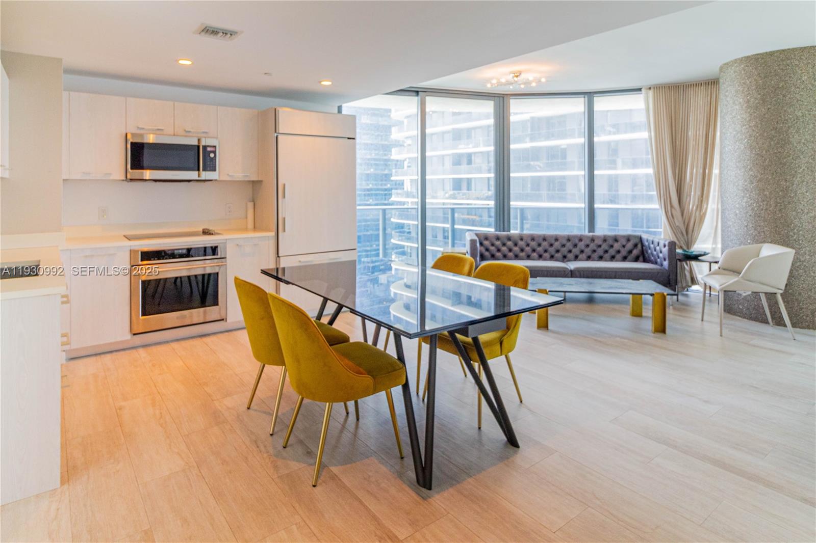 45 Southwest 9th Street, Unit 3601 Miami, FL 33130 - Photo 8 of 19 a dining room with furniture and window