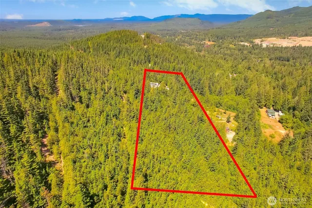 a view of a lake with a yard