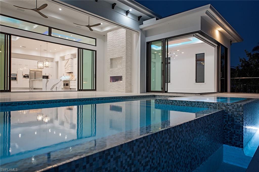 1840 Sandpiper Street Naples, FL 34102 - Photo 3 of 11 a view of a house with a porch