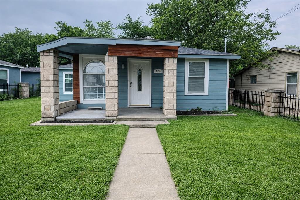 7539 Red Bud Drive Dallas, TX 75227 - Photo 1 of 2 a front view of a house with a garden