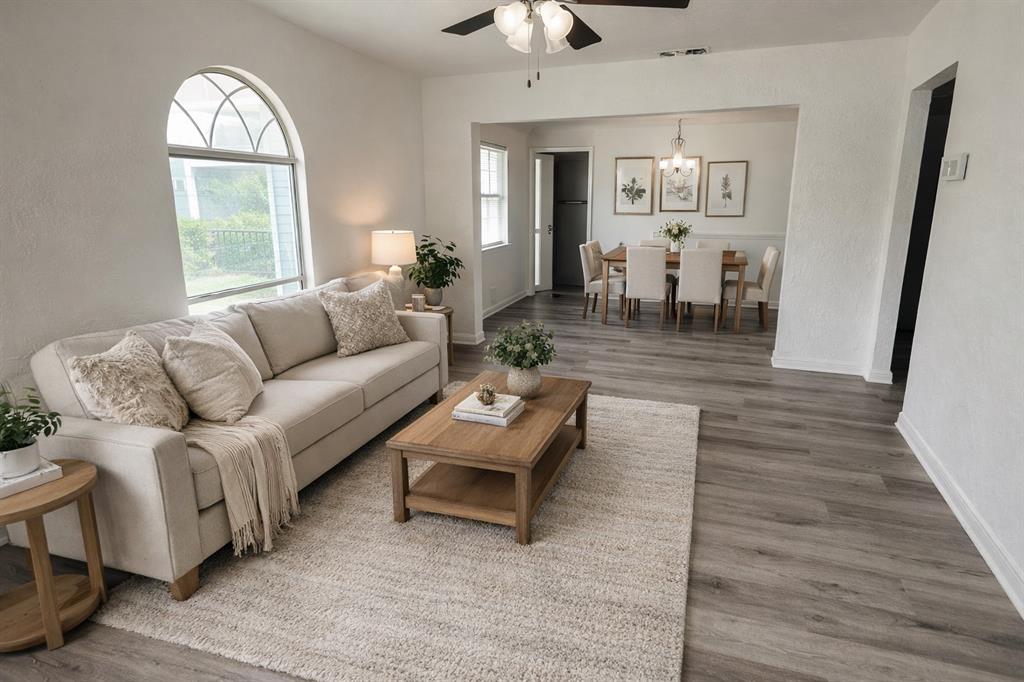 7539 Red Bud Drive Dallas, TX 75227 - Photo 2 of 2 a living room with furniture and a large mirror next to a window