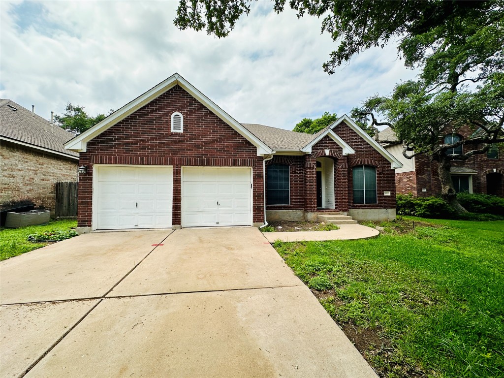 6514 Clairmont Drive Austin, TX 78749 - Photo 1 of 1 a front view of a house with yard
