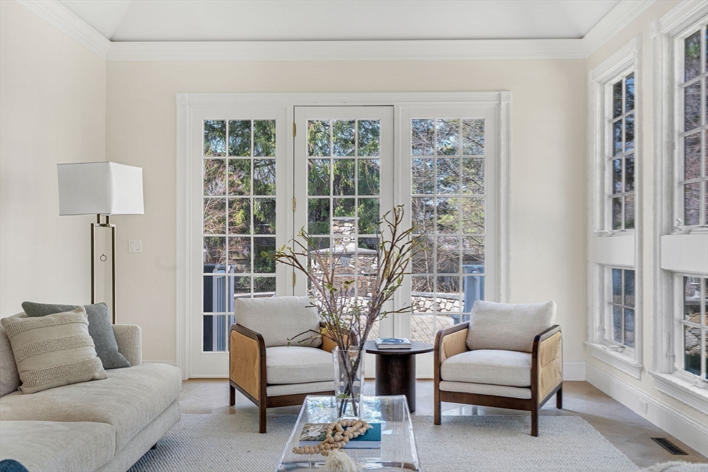 1 Stonefield Lane Wellesley, MA 02482 - Photo 13 of 30 a living room with furniture and a large window