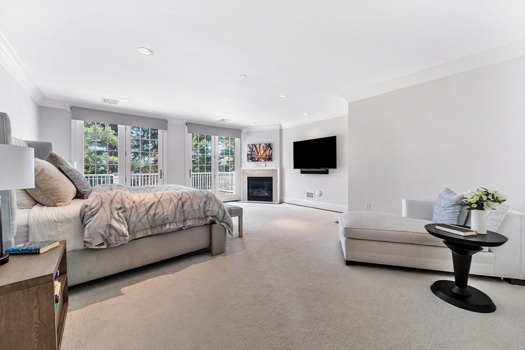 1 Stonefield Lane Wellesley, MA 02482 - Photo 14 of 30 a bedroom with a bed and a flat screen tv