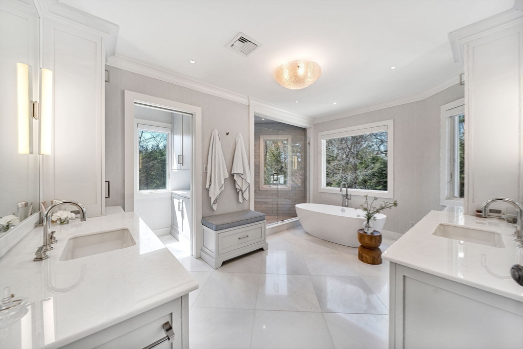 1 Stonefield Lane Wellesley, MA 02482 - Photo 15 of 30 a spacious bathroom with a sink mirror and a bathtub