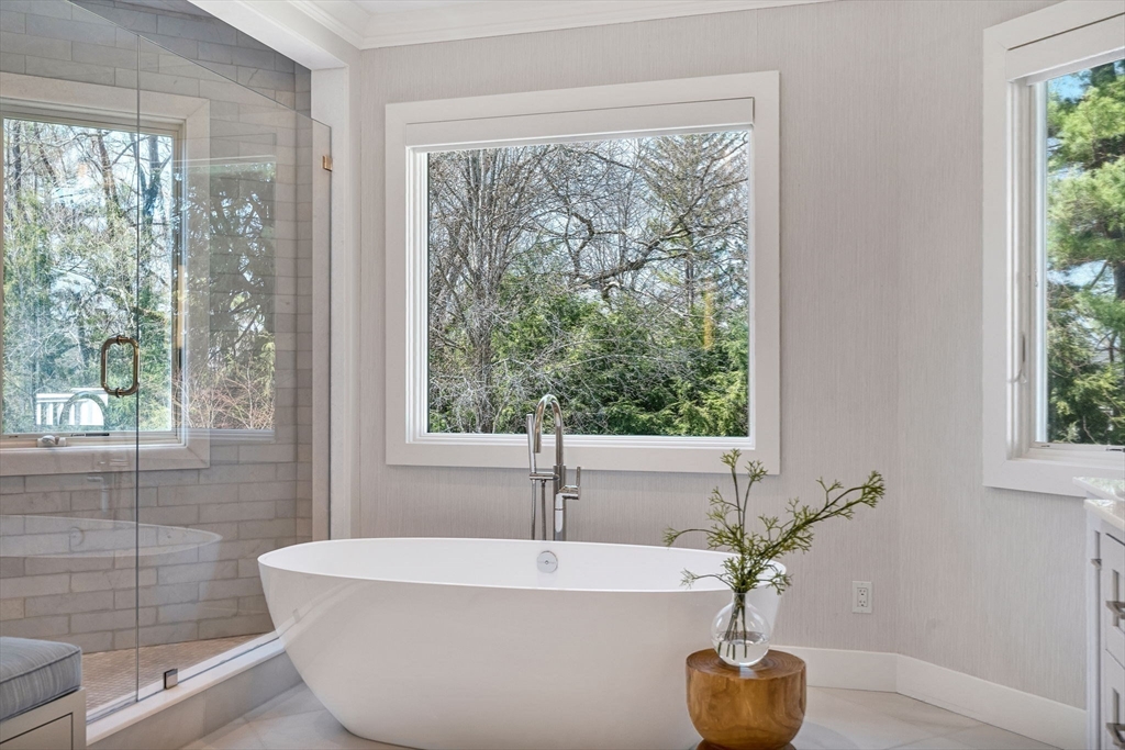 1 Stonefield Lane Wellesley, MA 02482 - Photo 16 of 30 a white bath tub sitting in a bathroom next to a window