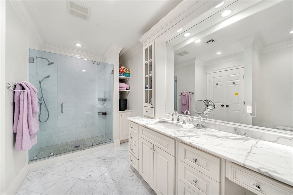 1 Stonefield Lane Wellesley, MA 02482 - Photo 20 of 30 a spacious bathroom with a granite countertop sink mirror and shower