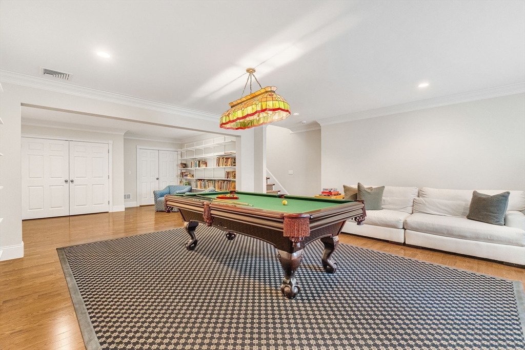 1 Stonefield Lane Wellesley, MA 02482 - Photo 25 of 30 a living room with furniture a rug and a chandelier