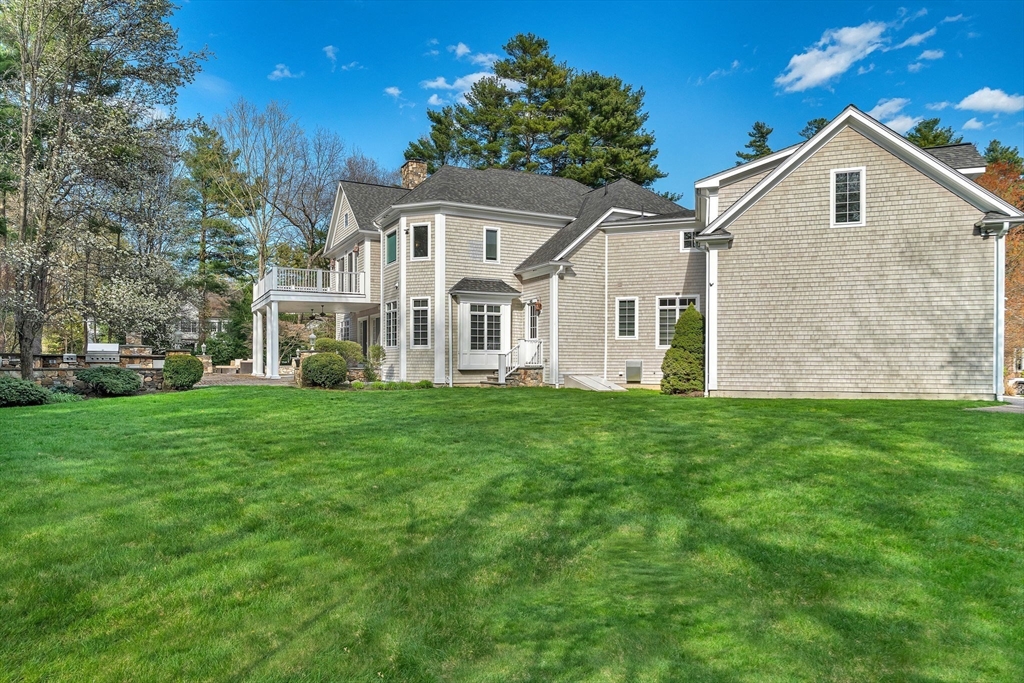 1 Stonefield Lane Wellesley, MA 02482 - Photo 30 of 30 front view of a house with a yard