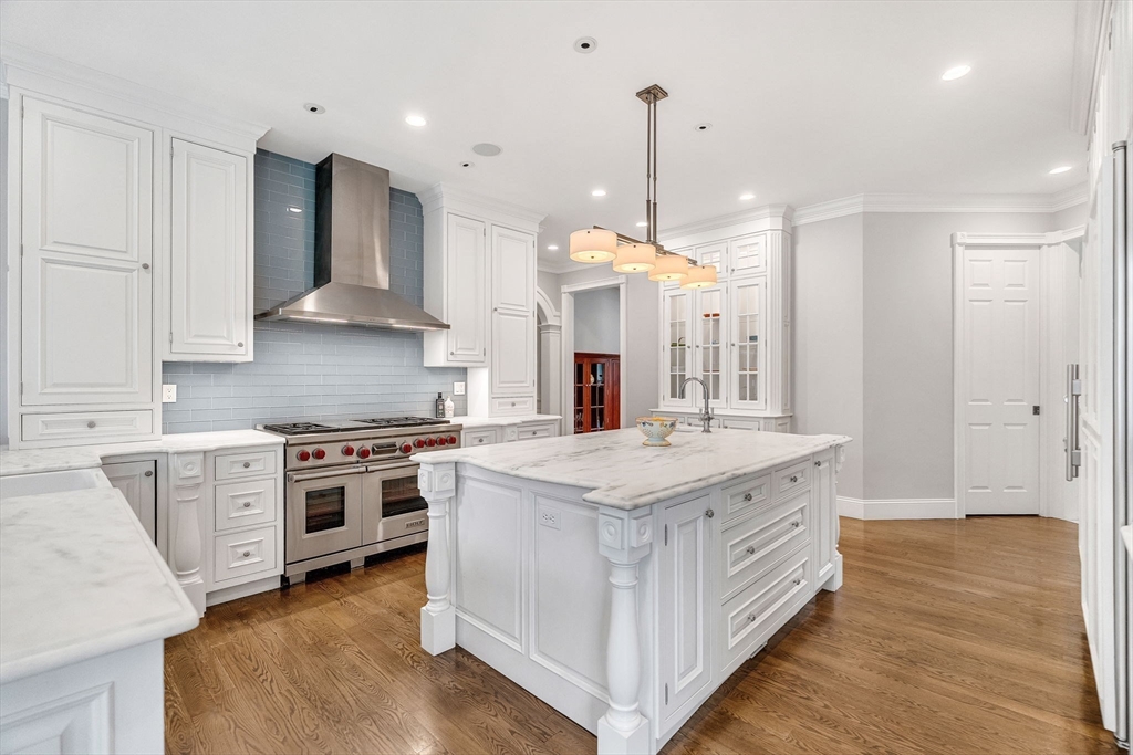 1 Stonefield Lane Wellesley, MA 02482 - Photo 4 of 30 a large kitchen with stainless steel appliances granite countertop a stove and a sink