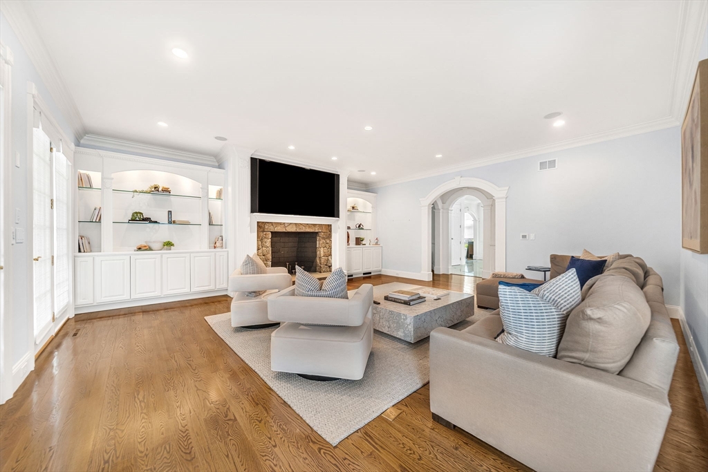 1 Stonefield Lane Wellesley, MA 02482 - Photo 6 of 30 a living room with furniture fireplace and a flat screen tv