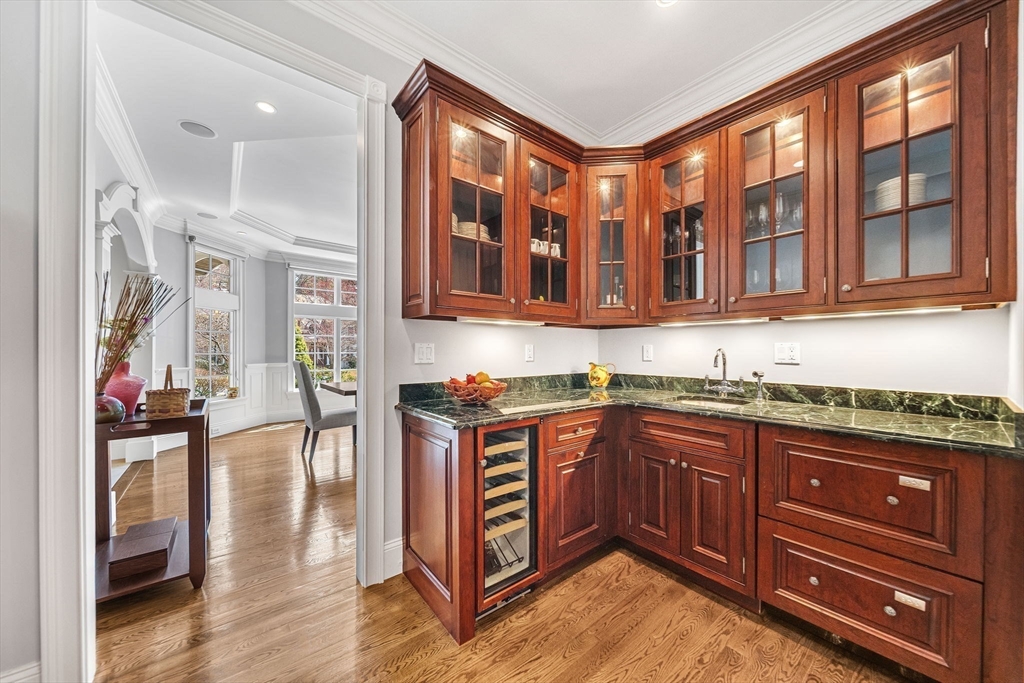 1 Stonefield Lane Wellesley, MA 02482 - Photo 10 of 30 a kitchen with stainless steel appliances granite countertop a stove and cabinets