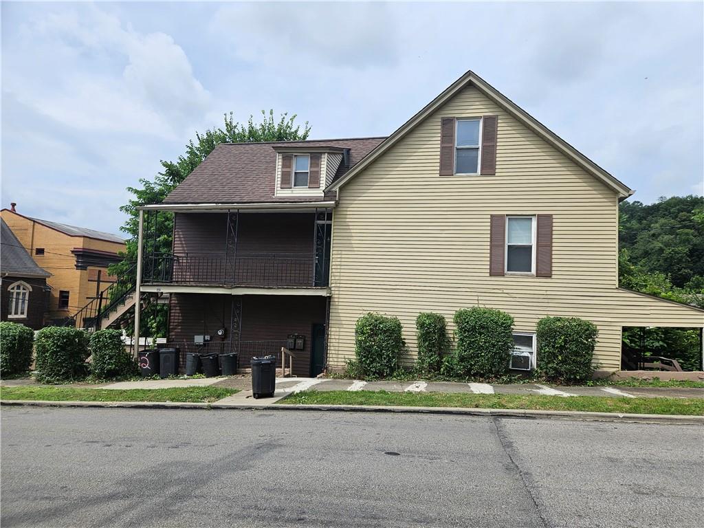 a front view of a house with a yard and porch