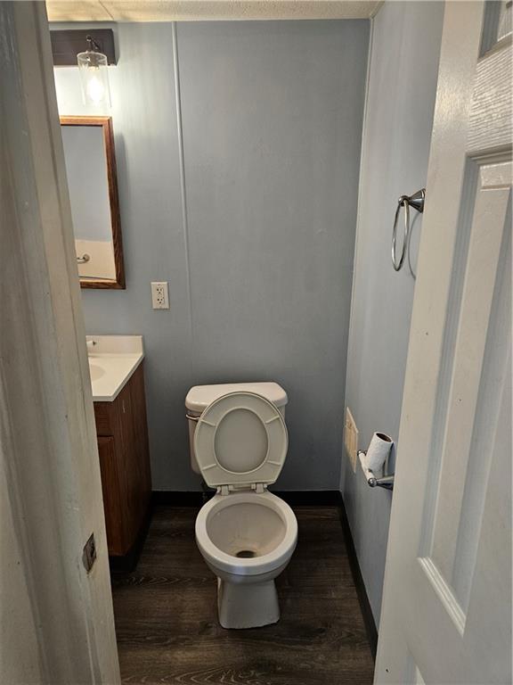 502 Center Avenue, Unit 2 Pitcairn, PA 15140 - Photo 14 of 28 a white toilet sitting in a bathroom next to a sink