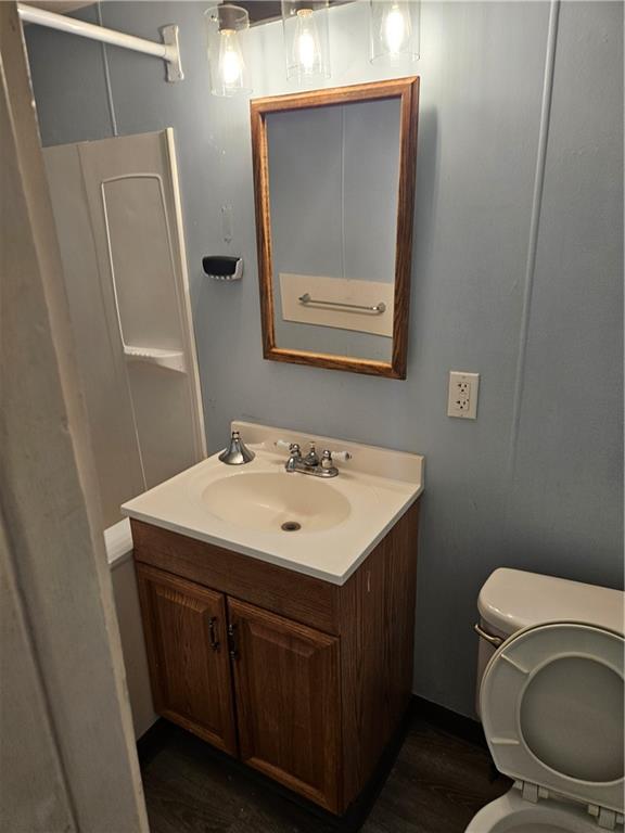 502 Center Avenue, Unit 2 Pitcairn, PA 15140 - Photo 17 of 28 a bathroom with a toilet sink and mirror