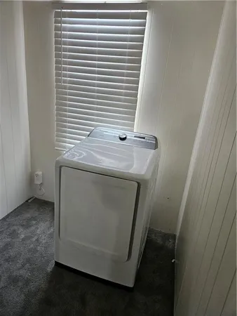 a view of a bathroom from a hallway