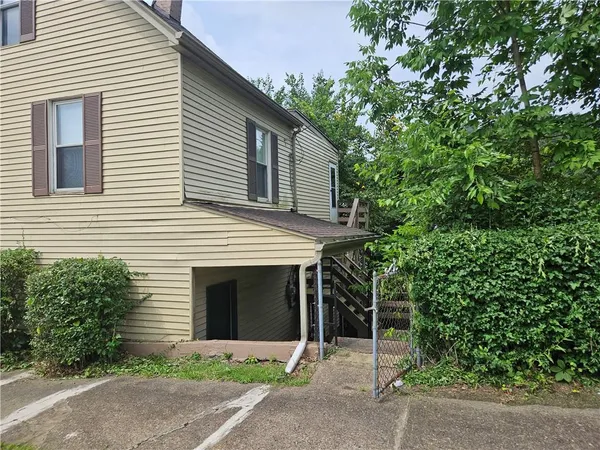 a front view of a house with yard