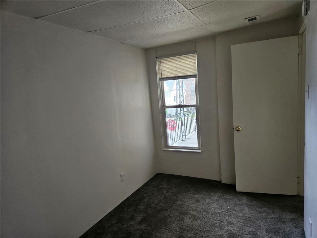 502 Center Avenue, Unit 2 Pitcairn, PA 15140 - Photo 26 of 28 an empty room with windows