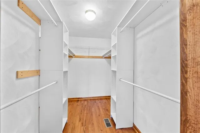 a view of an entryway with wooden floor