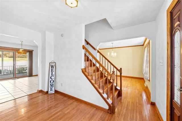 a view of an entryway with wooden floor
