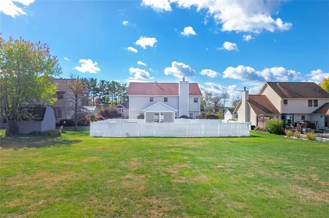 a view of a house with a yard porch and sitting area