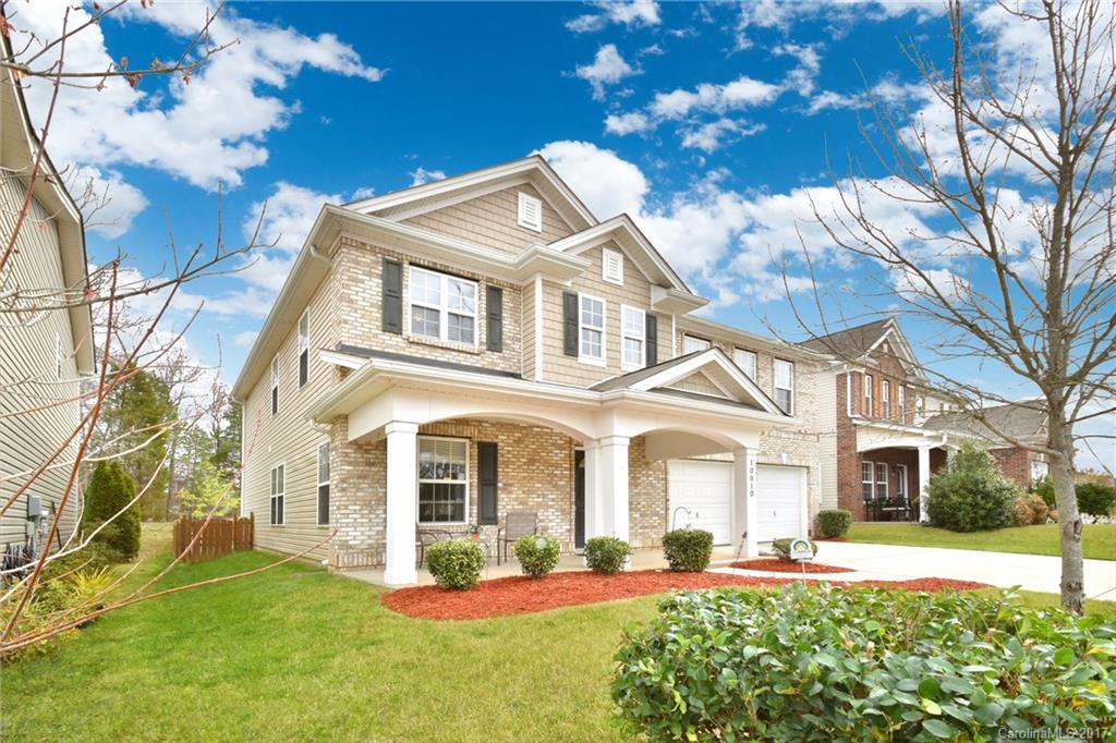 10010 Rocky Ford Club Road Charlotte, NC 28269 - Photo 2 of 24 a front view of a house with a yard