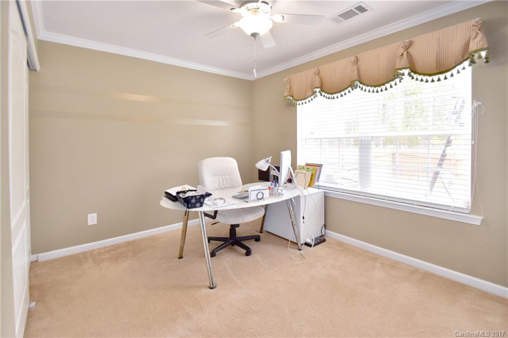 10010 Rocky Ford Club Road Charlotte, NC 28269 - Photo 13 of 24 a view of a workspace with furniture and a window