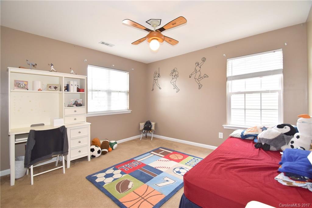 10010 Rocky Ford Club Road Charlotte, NC 28269 - Photo 17 of 24 a bedroom with a bed and a window