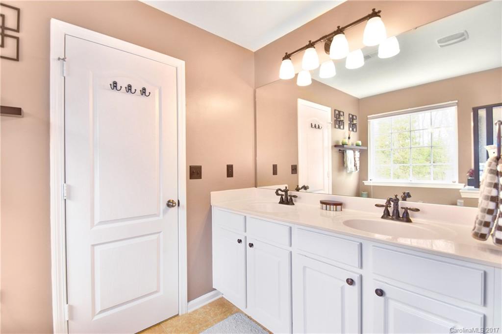 10010 Rocky Ford Club Road Charlotte, NC 28269 - Photo 20 of 24 a bathroom with a double vanity sink mirror and double