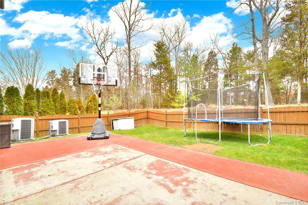 10010 Rocky Ford Club Road Charlotte, NC 28269 - Photo 23 of 24 a view of yard with swimming pool and sitting area