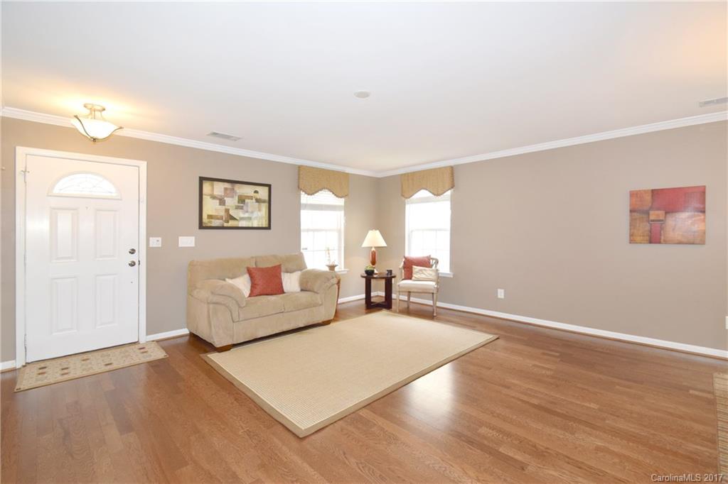 10010 Rocky Ford Club Road Charlotte, NC 28269 - Photo 4 of 24 a living room with furniture and a wooden floor