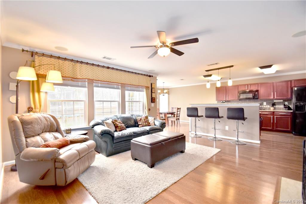 10010 Rocky Ford Club Road Charlotte, NC 28269 - Photo 7 of 24 a living room with furniture and a large window