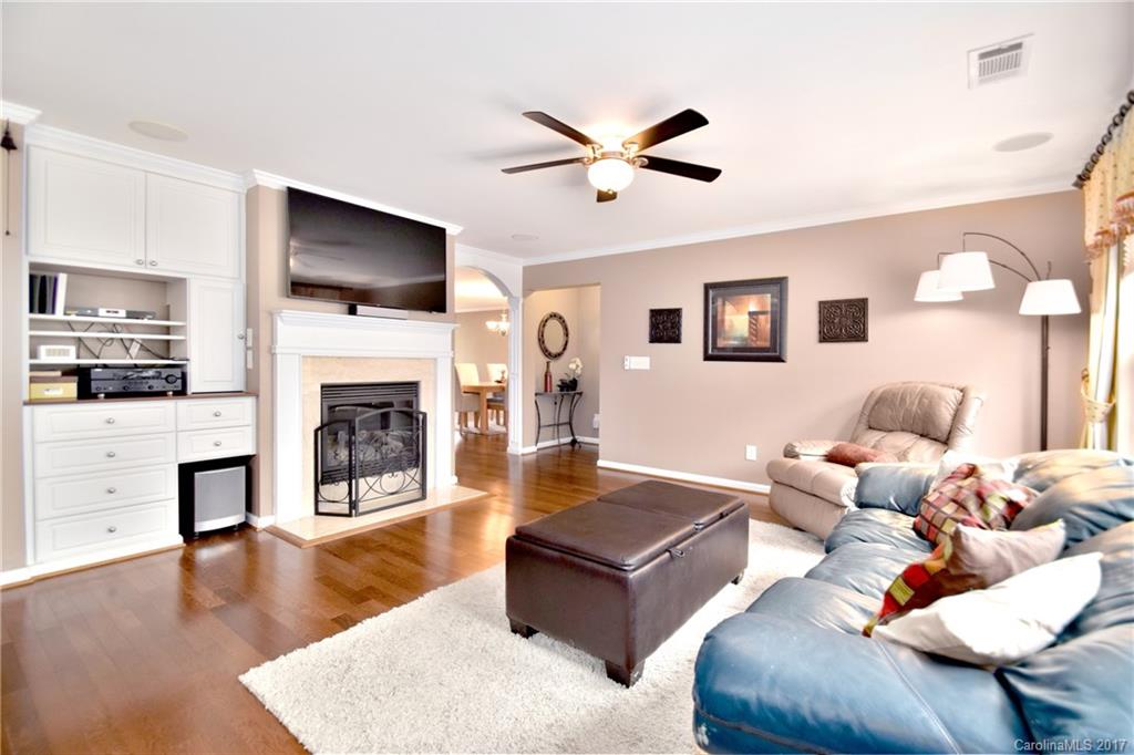 10010 Rocky Ford Club Road Charlotte, NC 28269 - Photo 8 of 24 a living room with furniture fireplace and flat screen tv