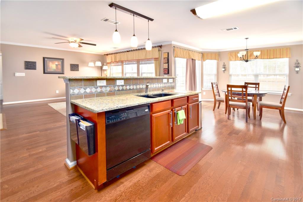 10010 Rocky Ford Club Road Charlotte, NC 28269 - Photo 10 of 24 a kitchen with stainless steel appliances granite countertop a stove and cabinets